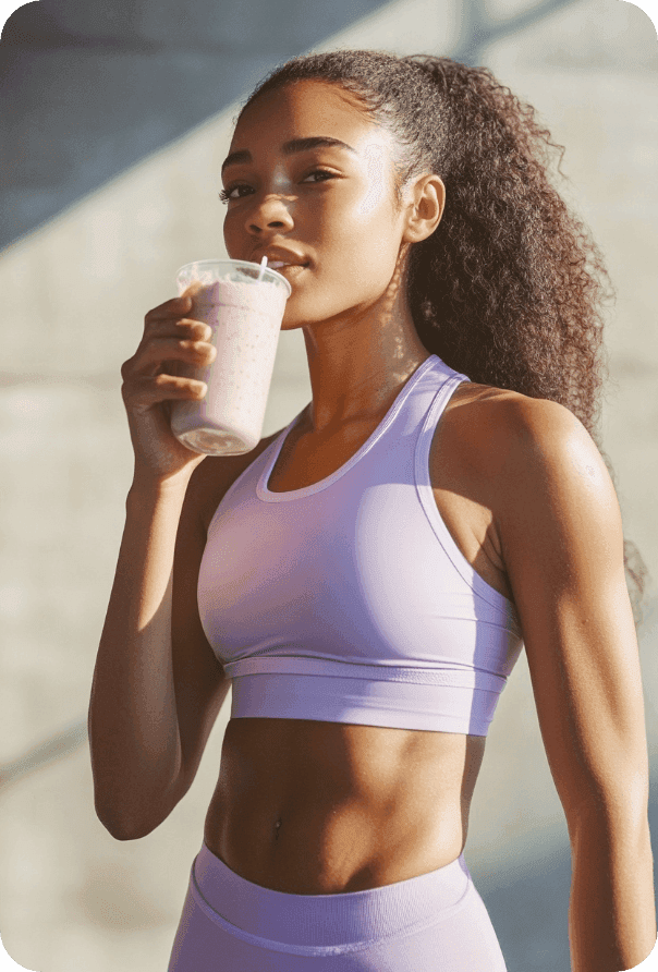Woman drinking a smoothie after a workout